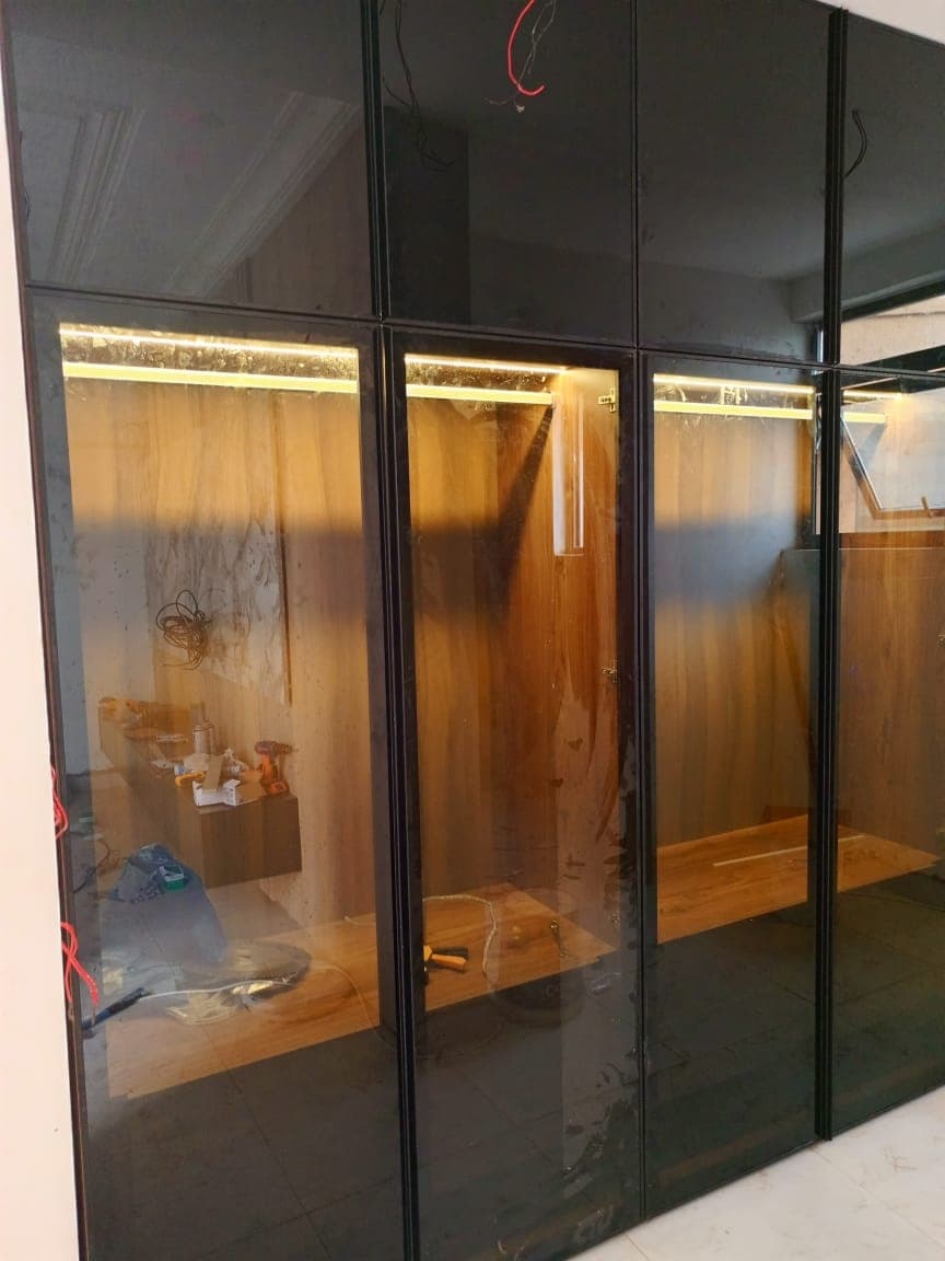 Black glass wardrobe with LED lighting — Tech1 Wood Works Accra
